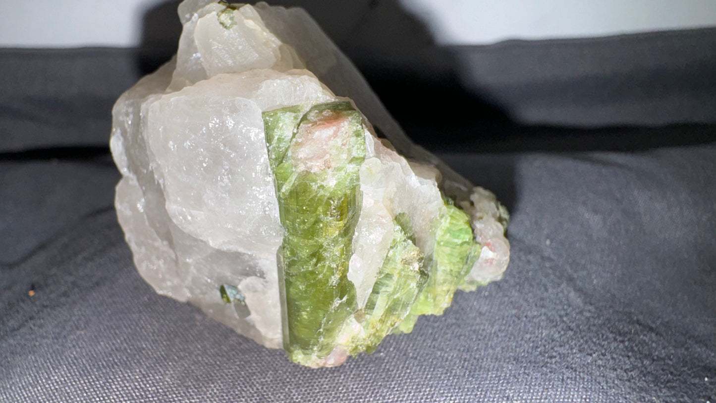 Green/pink tourmaline on quartz